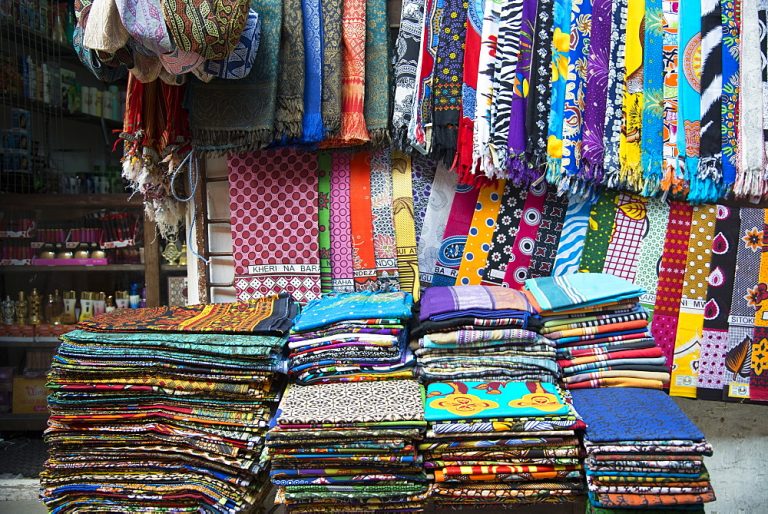 Colourful African fabrics on display in the market in Stone Town, Zanzibar, Tanzania, East Africa, Africa